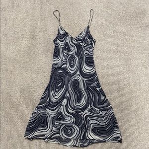 Tessito slip dress with spaghetti straps.